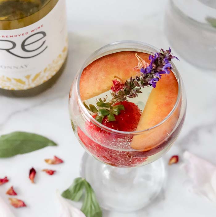 color image of a glass of FRE Alcohol-Removed Chardonnay with fruit and garnish